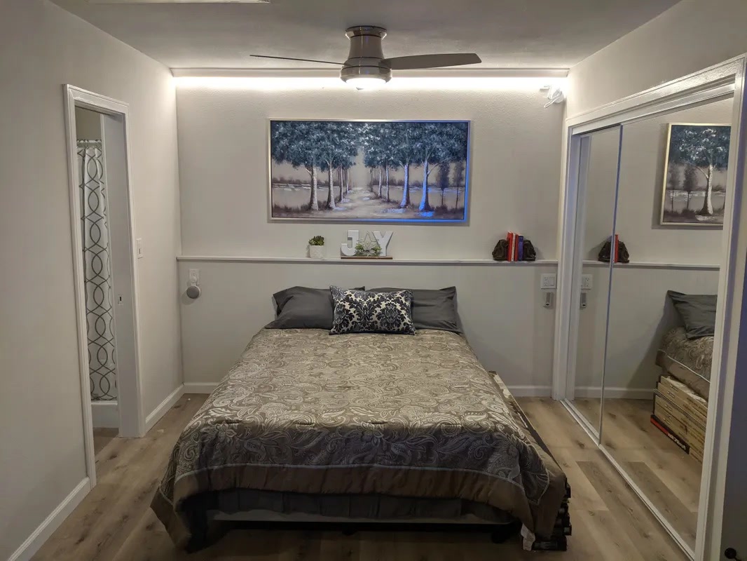 Completed ADU bedroom with mirrored closet in Ventura County